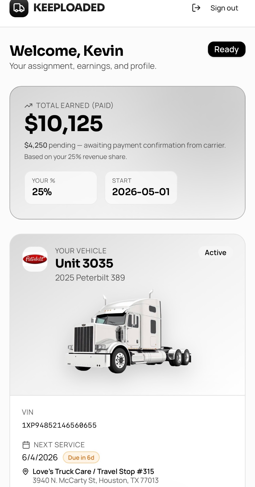 KeepLoaded driver dashboard on mobile showing earnings, vehicle assignment, and next service